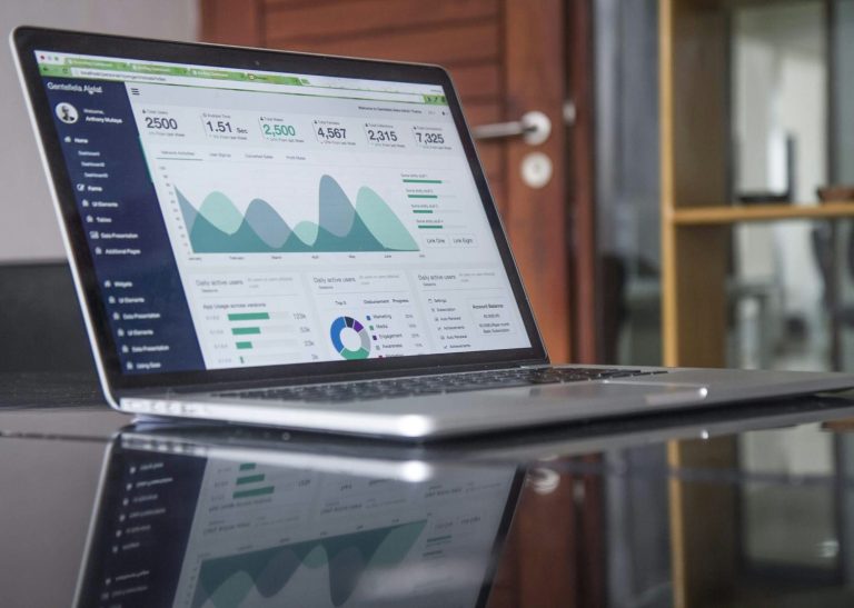 Laptop on the table showing analytics report.